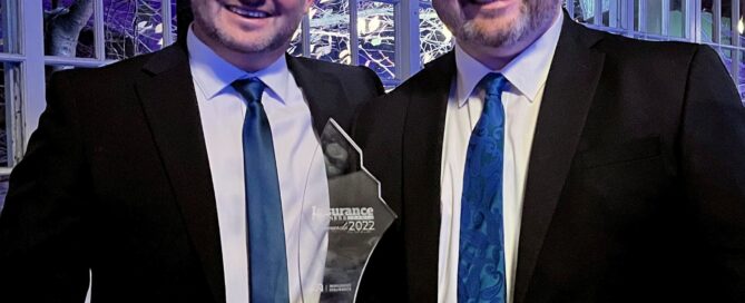 Two men with an award
