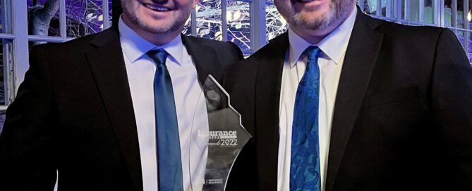 Two men with an award