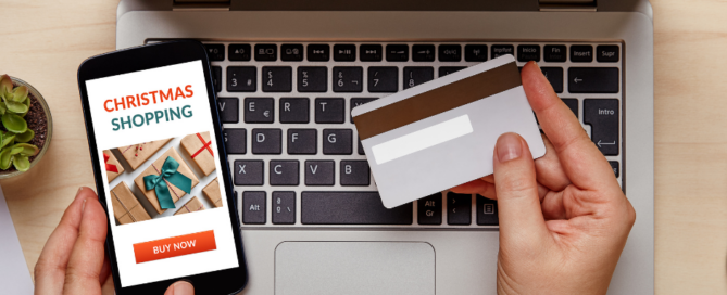 A credit card, a mobile phone, and a laptop