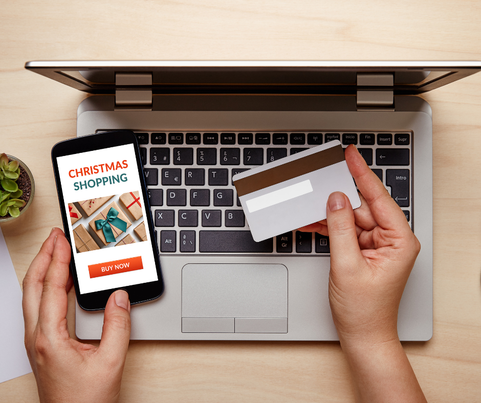 A credit card, a mobile phone, and a laptop