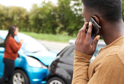 A man on the phone after a car accident