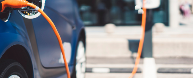 An electric car plugged in to charge